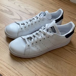 White and navy blue adidas sneakers
